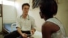 FILE - A physician talks to a patient who is HIV positive at a social and medical assistance clinic in Abidjan, Ivory Coast, Monday March 19, 2001. 