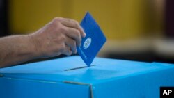 An Israeli man casts his vote during Israel's general elections in Tel Aviv, Israel, April 9, 2019.
