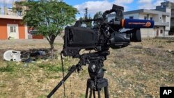 The damaged camera of pan-Arab TV network Al-Mayadeen cameraman Rabih Maamari, who was killed in an Israeli strike, is seen at the Lebanese border village of Tair Harfa near the border with Israel, Tuesday, Nov. 21, 2023.