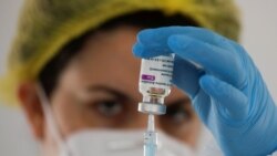 FILE PHOTO: A healthcare worker prepares a dose of the AstraZeneca vaccine against the coronavirus disease (COVID-19) during a vaccination rollout for teachers in Ronda, Spain February 25, 2021. REUTERS/Jon Nazca/File Photo
