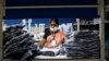 An employee sorts pieces of cloth at the Estee garment factory in Tirupur, in the southern Indian state of Tamil Nadu, June 19, 2013.