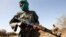 FILE - A soldier preparing to fight terrorists in the Sahel trains with U.S. advisers near Goa, Mali, in 2006. Terror attacks claimed by Islamist militants against civilians and military targets have risen recently in Burkina Faso, Mali and Niger.