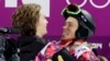 Switzerland's Iouri Podladtchikov (l) celebrates with Shaun White of the United States after Podladtchikov won the gold medal in the men's snowboard halfpipe final in Sochi, Feb 11, 2014.
