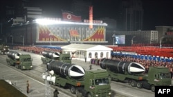 This picture taken on Jan. 14, 2021 and released by North Korea's official Korean Central News Agency shows what appears to be submarine-launched ballistic missiles during a military parade.