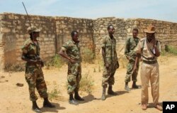 FILE - Ethiopian soldiers serving in AMISOM patrol in Somalia, Feb. 29, 2012.