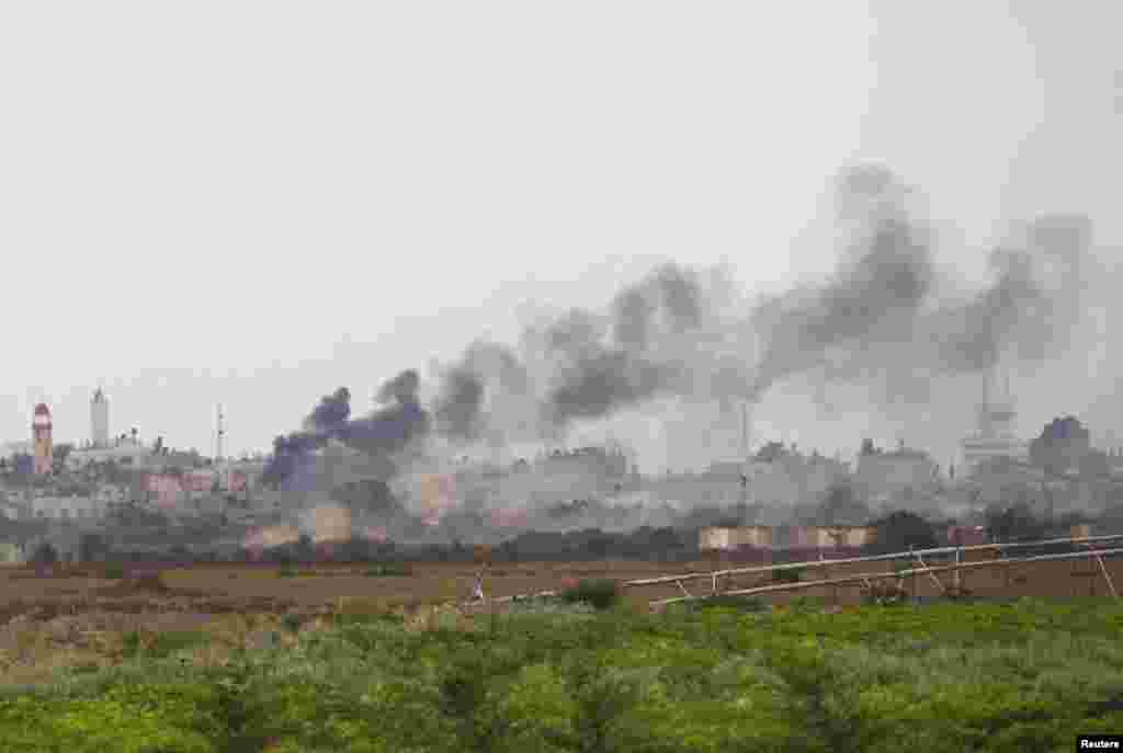 Smoke rises after an Israeli strike over southern Gaza, July 18, 2014. 