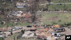 Debris is scattered from damaged homes in Chattanooga, Tenn., April 14, 2020. 