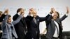 FILE - Participants react during the final plenary session at the World Climate Change Conference 2015 (COP21) at Le Bourget, near Paris, France, Dec. 12, 2015. 