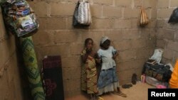 FILE - Children who escaped Boko Haram attacks in both Nigeria and Cameroon are seen inside an uncompleted house as they seek shelter in Adamawa, Nigeria, Jan. 31, 2015. 