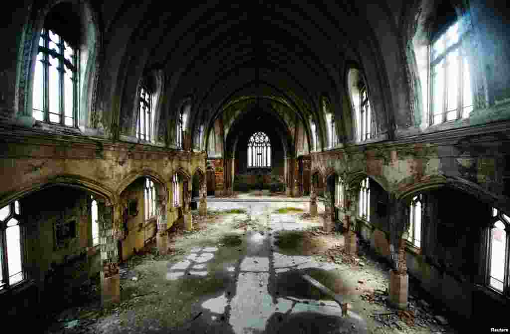 The inside of the abandoned "Martyrs of Uganda Catholic Church in Detroit. When a Catholic church closes, the land and buildings go back to the archdiocese. If a new tenant doesn't materialize, criminals sometimes do. 