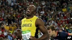 Usain Bolt from Jamaica celebrates after crossing the line to win the gold medal in the men's 200-meter final during the athletics competitions of the 2016 Summer Olympics at the Olympic stadium in Rio de Janeiro, Brazil, Thursday, Aug. 18, 2016.