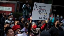 FILE - People take part in a Stop Asian Hate rally at Times Square in New York City, April 4, 2021.