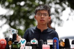 Hong Kong democracy activist Joshua Wong speaks outside the Legislative Council building in Hong Kong, July 2, 2019.