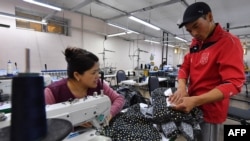 Sewer Argen Bolgonbekov, 29, works at a textile workshop in the Kyrgyz capital Bishkek on Oct. 17, 2023.