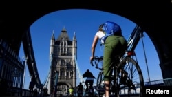 A cyclist is seen on Tower Bridge, following the outbreak of the coronavirus disease (COVID-19), in London, May 15, 2020. 