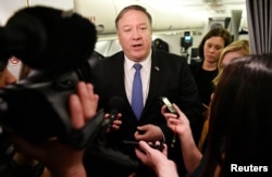 U.S. Secretary of State Mike Pompeo speaks to reporters in flight after a previously unannounced trip to Baghdad, Iraq, May 8, 2019.