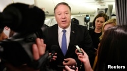U.S. Secretary of State Mike Pompeo speaks to reporters in flight after a previously unannounced trip to Baghdad, Iraq, May 8, 2019.