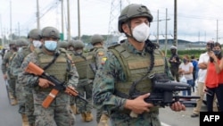 Members of the Ecuadorian Marine Force patrol outside the Zone 8 Deprivation of Liberty Center in Guayaquil, Ecuador, on Feb. 23, 2021. 