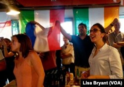 Elodie Grevet has her loyalties to Les Bleus -- France’s national colors -- painted on her cheeks.