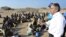 UN refugee agency chief Antonio Guterres (R) speaks to Ethiopian illegal immigrants from the Oromo region waiting for smugglers' boats to cross the Gulf of Aden into Yemen. Each year tens of thousands of Ethiopians and Somalis make the perilous crossing t