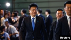 Japan's Defense Minister Minoru Kihara walks on the day of the cabinet reshuffle at the Prime Minister's office in Tokyo, Japan, Sept. 13, 2023. 