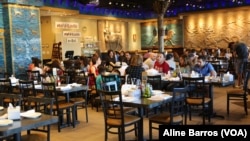 The Ishtar Restaurant, its walls hung with reproductions of Assyrian deities, is a "piece of home" for Iraqi nationals who come for the authentic Iraqi food and glass clinking presentations that proclaim "tea time," in Sterling Heights, Michigan, July 31, 2017.