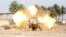 Iraqi security forces fire cannon during clashes with al Qaeda-linked Islamic State in Iraq and the Levant (ISIL), Jurf al-Sakhar, south of Baghdad, March 19, 2014.
