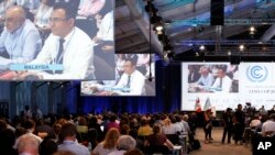 Delegasi menghadiri Konferensi Perubahan Iklim PBB di Lima, Peru, 13 Desember 2014. 