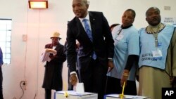 Democratic Alliance leader Mmusi Maimane casts his vote Wednesday, May 8, 2019 in general elections in Soweto, South Africa. 