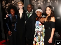 Viola Davis, from left, Elizabeth Debicki, Steve McQueen, Cynthia Erivo and Michelle Rodriguez attend a special screening of "Widows" at Brooklyn Academy of Music in New York, Nov. 11, 2018.
