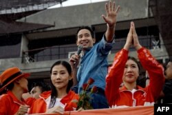 TOPSHOT - Move Forward Party leader and former prime ministerial candidate Pita Limjaroenrat waves as he addresses a crowd during a rally on Jomtien Beach in Pattaya on July 22, 2023. (Photo by Jack TAYLOR / AFP)