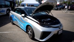 A 2021 Toyota Prius that runs on a hydrogen fuel cell sits on display at the Denver auto show Friday, Sept. 17, 2021, at Elitch's Gardens in downtown Denver. (AP Photo/David Zalubowski)