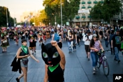 Women march against sexism and gender violence, in Santiago, Chile, Thursday, Nov. 22, 2018. (AP Photo/Esteban Felix)