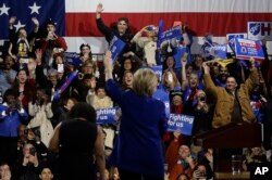 Democratic presidential candidate Hillary Clinton waves to supporters before speaking during a rally in New York on March 2, 2016.