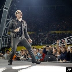Lead singer Bono of Irish rock band U2 performs during their 360 Degree Tour (file photo)