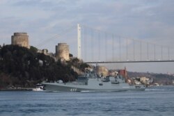 FILE - The Russian Navy's frigate Admiral Makarov sets sail in the Bosphorus, on its way to the Mediterranean Sea, in Istanbul, Turkey, Feb. 28, 2020.