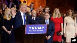 Surrounded by family and supporters, Republican presidential candidate Donald Trump speaks during a New York primary night campaign event, April 19, 2016, in New York. Trumps new campaign chief says the candidate has been "projecting an image" in order to energize voters in the primary election campaign. 