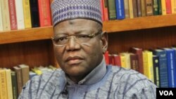 A shepherd guides a flock of sheep through central Madrid, Spain.