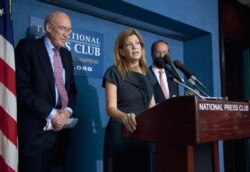 FILE - Maya MacGuineas, president of the Committee for a Responsible Federal Budget, center, speaks during a news conference on deficit reduction at the National Press Club in Washington, Sept. 12, 2011.