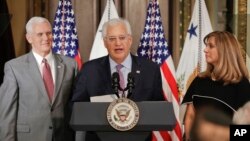 U.S. Ambassador to Israel David M. Friedman, center, accompanied by his wife Tammy, right, speaks after Vice President Mike Pence administered the oath of office, March 29, 2017, in the Eisenhower Executive Office Building in Washington. 
