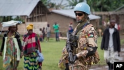 A Jordanian UN peacekeeper stands guard outside a base camp in the town of Bunagana, in Congo, May 16, 2012. 
