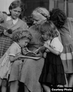 Dorothy Day with her grandchildren in 1958. (Marquette University Archives)