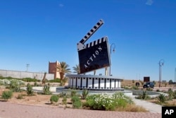 Movie-themed municipal art is seen on a traffic circle in Ouarzazate where dozens of foreign movies are filmed every year, Jan. 29, 2015.