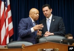 House Oversight and Government Reform Committee Chairman Rep. Jason Chaffetz, R-Utah, right, confers with the committee's ranking member Rep. Elijah Cummings, D-Md., on Capitol Hill in Washington, July 7, 2016, prior to hearing testimony from FBI Director James Comey.