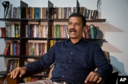 Asif Nazrul, a law professor at Dhaka University and a government critic, speaks to the Associated Press in Dhaka, Bangladesh, Jan. 1, 2019.