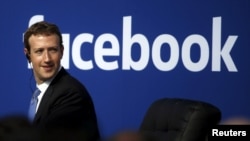 FILE - Facebook CEO Mark Zuckerberg on stage during a town hall at Facebook's headquarters in Menlo Park, California.