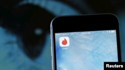 FILE - The dating app Tinder is shown on an Apple iPhone. 