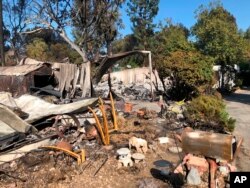 Charred property is seen in the Seminole Springs Mobile Home Park, Nov. 11, 2018, after a wildfire tore through the area in Agoura Hills, California.