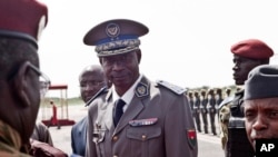 A Palestinian man sharpens a knife that will be used to slaughter cattle or cut meat during the Muslim festival of sacrifice Eid al-Adha, in a workshop in Gaza City.