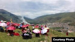 Tibetans in China’s Sichuan province attempt to commemorate the Dalai Lama’s birthday on July 6, 2013.